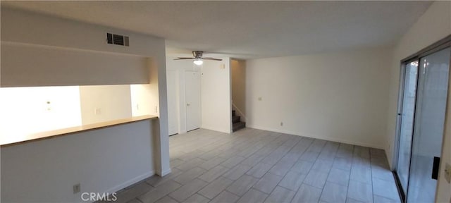 unfurnished room with ceiling fan and light wood-type flooring