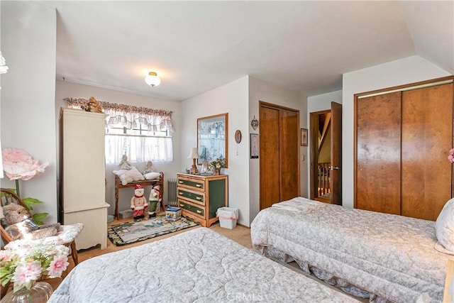 bedroom featuring two closets and carpet