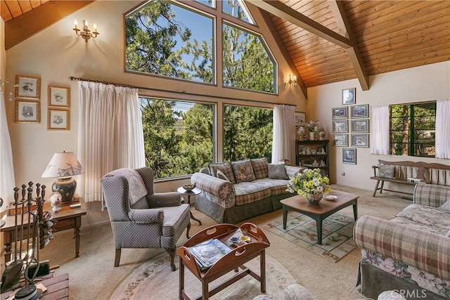 carpeted living room featuring a healthy amount of sunlight, beam ceiling, and high vaulted ceiling