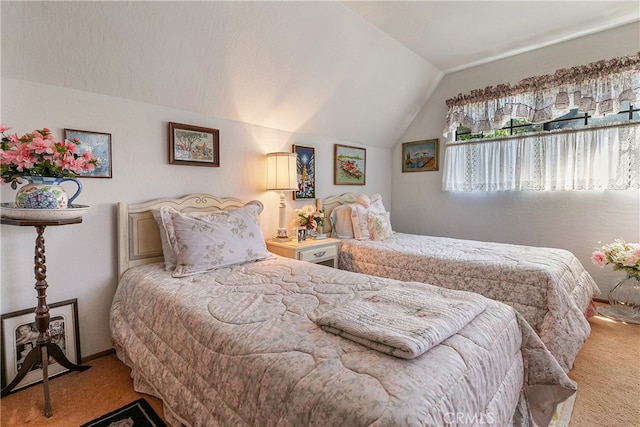 carpeted bedroom with lofted ceiling