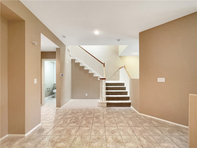 spare room featuring light tile patterned floors