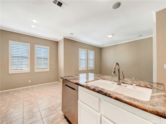 kitchen featuring sink, light stone counters, white cabinetry, and dishwasher