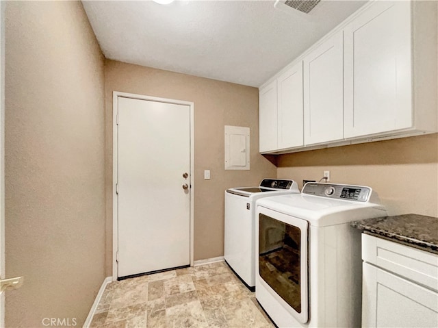 laundry area with cabinets, electric panel, and separate washer and dryer