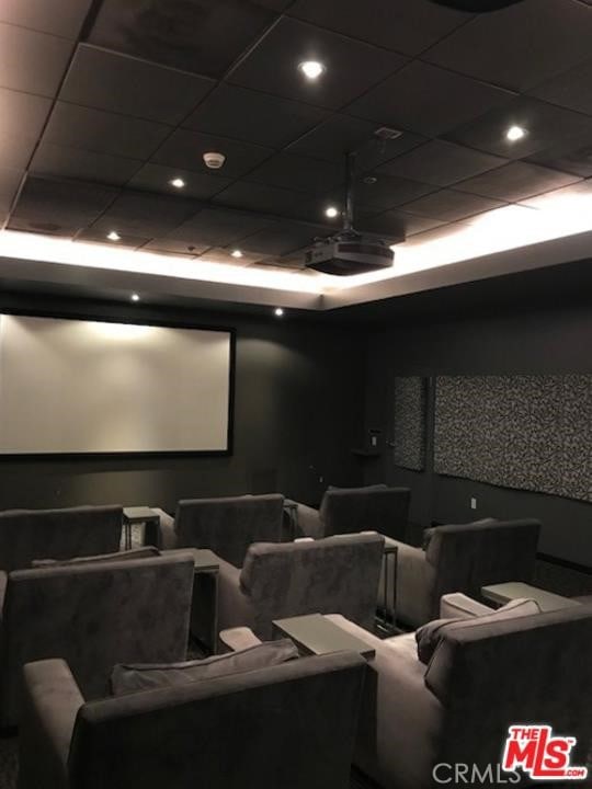 home theater room featuring a paneled ceiling and recessed lighting