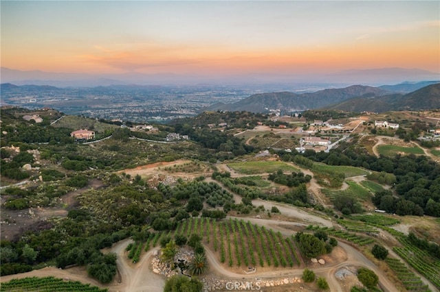 aerial view at dusk with a mountain view