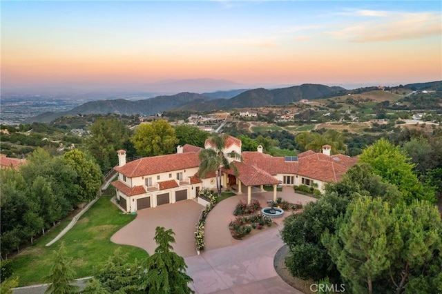 aerial view at dusk with a mountain view