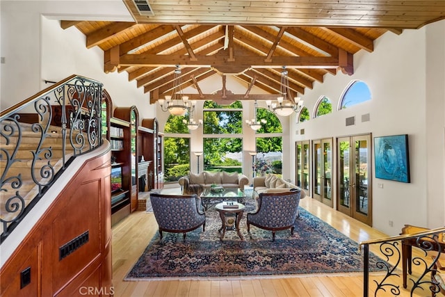 interior space featuring a chandelier, light hardwood / wood-style floors, and wooden ceiling