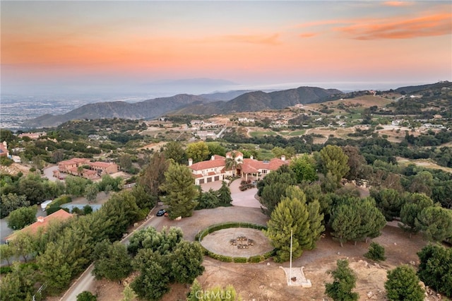 aerial view at dusk with a mountain view