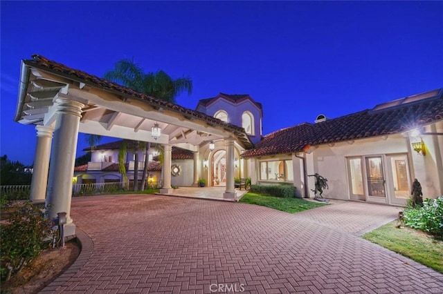 back house at twilight with french doors