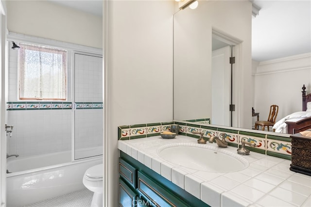 full bathroom with tile patterned flooring, vanity, toilet, and tiled shower / bath combo