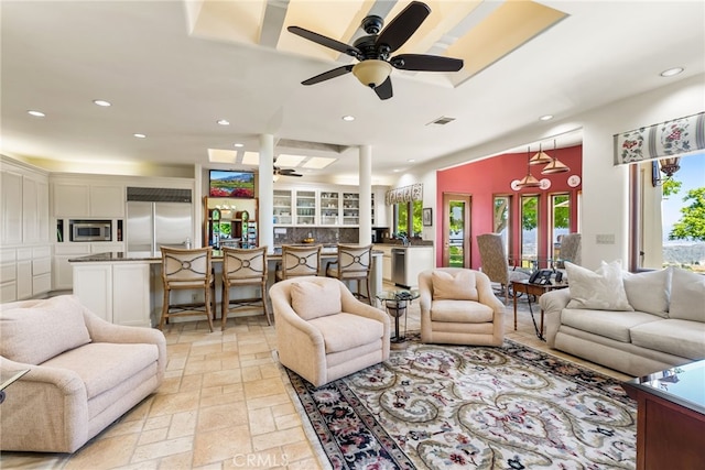 living room featuring ceiling fan