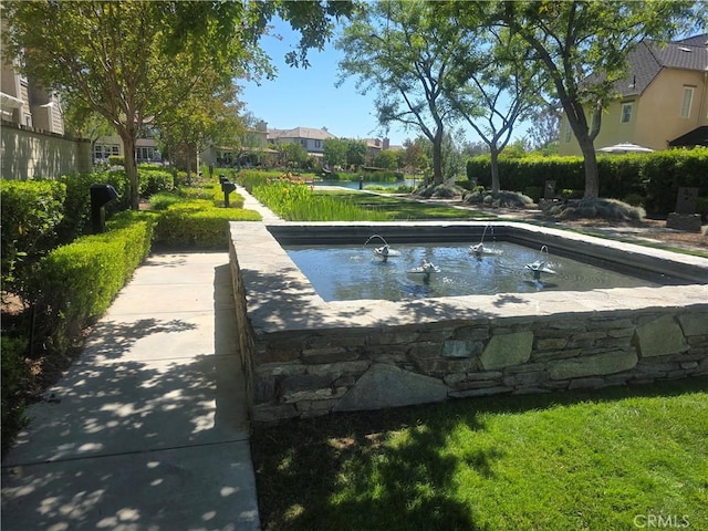 view of swimming pool with a residential view