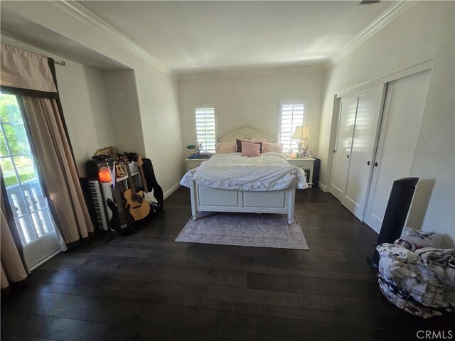 bedroom featuring a closet, dark wood-type flooring, and ornamental molding