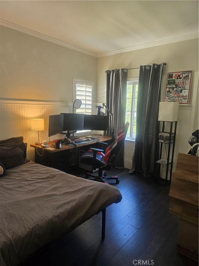 bedroom featuring dark hardwood / wood-style floors and ornamental molding