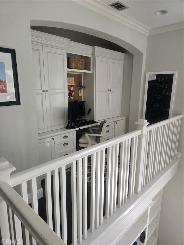 hallway featuring ornamental molding and visible vents