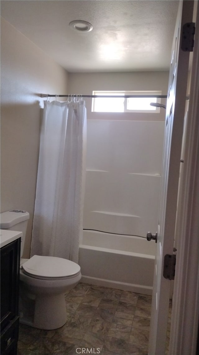 full bathroom featuring vanity, toilet, and shower / bath combo