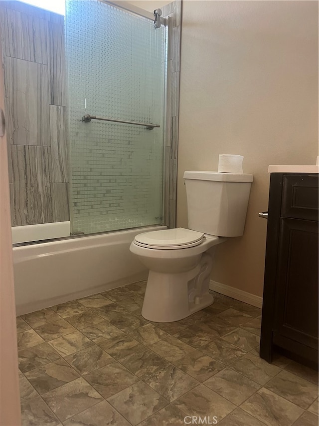 full bathroom with vanity, enclosed tub / shower combo, and toilet