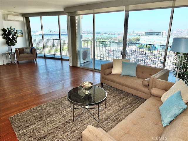 living room with dark hardwood / wood-style floors, floor to ceiling windows, and a wealth of natural light