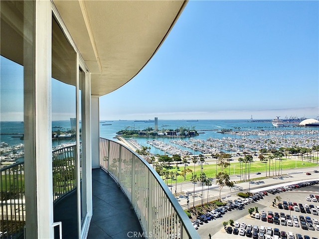 balcony featuring a water view