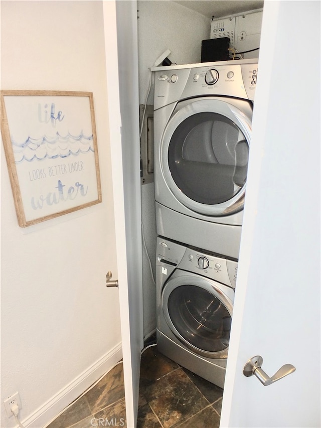 washroom with stacked washer / dryer