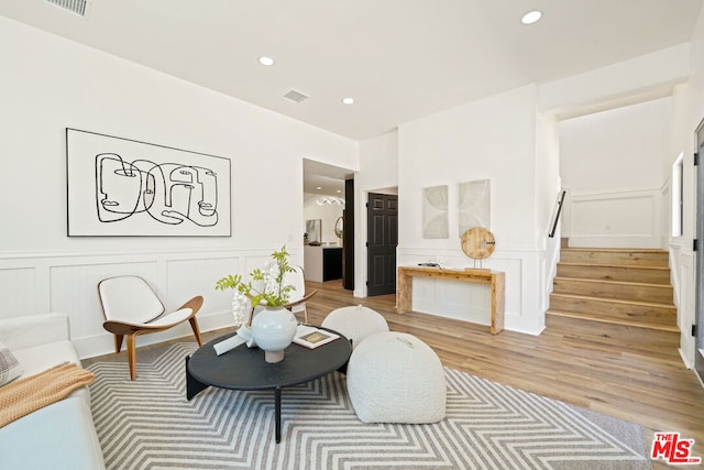 living room with light hardwood / wood-style flooring