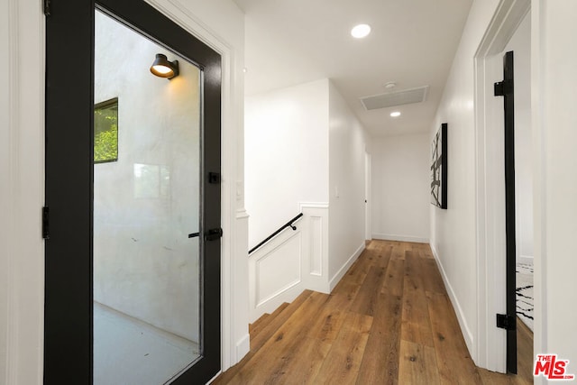 hall with light wood-type flooring