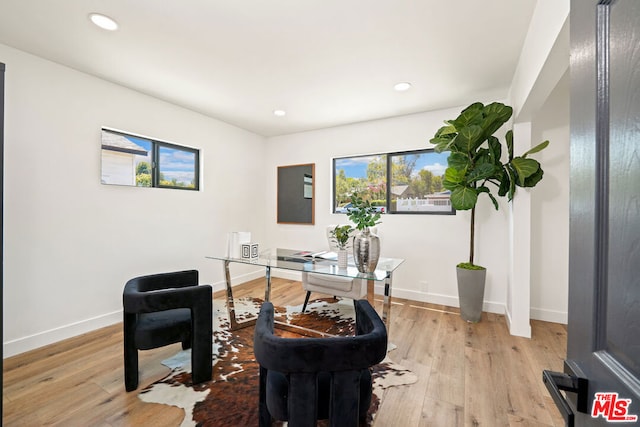 office with light wood-type flooring