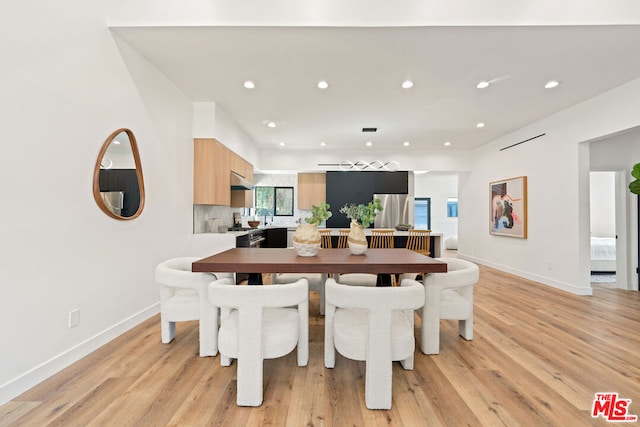 dining room with light hardwood / wood-style flooring