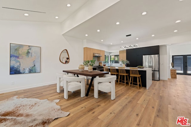 dining area with light hardwood / wood-style flooring