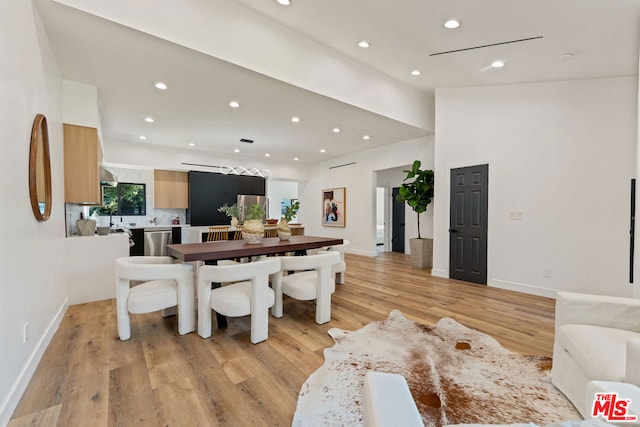 dining area with light hardwood / wood-style flooring