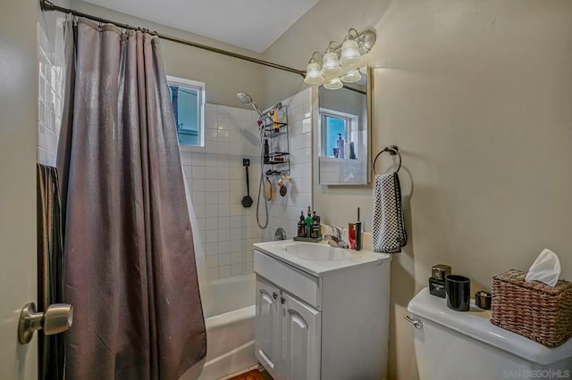 full bathroom with toilet, shower / bathtub combination with curtain, and vanity