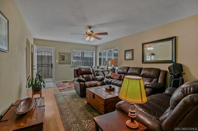 living room with ceiling fan and hardwood / wood-style floors