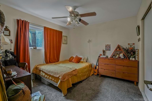 bedroom with a closet, ceiling fan, and dark colored carpet