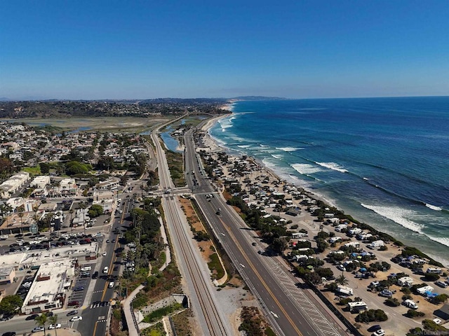 aerial view featuring a water view and a beach view