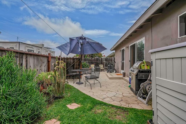 view of patio with a grill