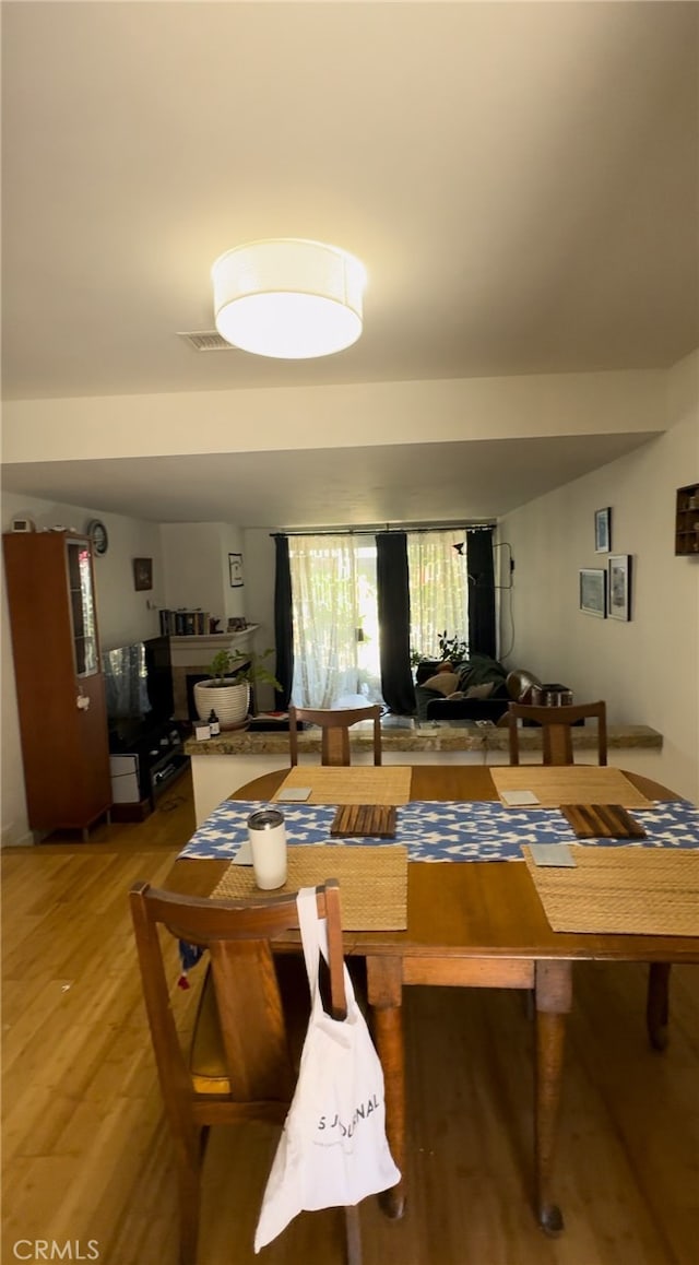 dining room featuring wood-type flooring