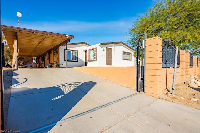 view of front of home featuring a carport