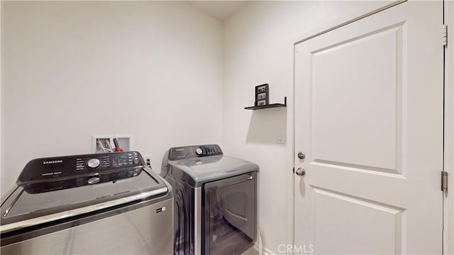 laundry room featuring washing machine and dryer