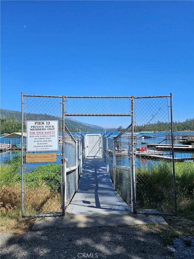 view of community with a water view