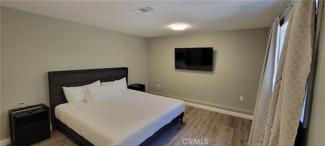 bedroom featuring light wood-type flooring