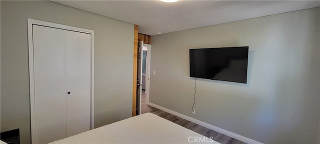 bedroom featuring a closet and hardwood / wood-style floors