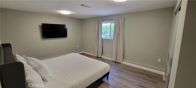 bedroom featuring wood-type flooring