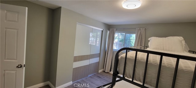 bedroom with light wood-type flooring