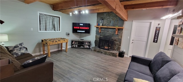 living room with beam ceiling, a fireplace, hardwood / wood-style flooring, and wooden ceiling