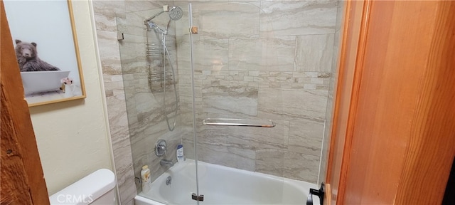 bathroom with toilet and tiled shower / bath combo