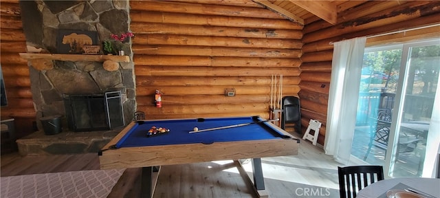 playroom featuring hardwood / wood-style flooring, billiards, vaulted ceiling with beams, and rustic walls