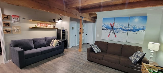 living room with beamed ceiling and hardwood / wood-style floors