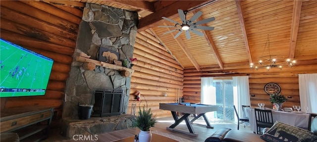 unfurnished living room with a fireplace, hardwood / wood-style flooring, rustic walls, and ceiling fan