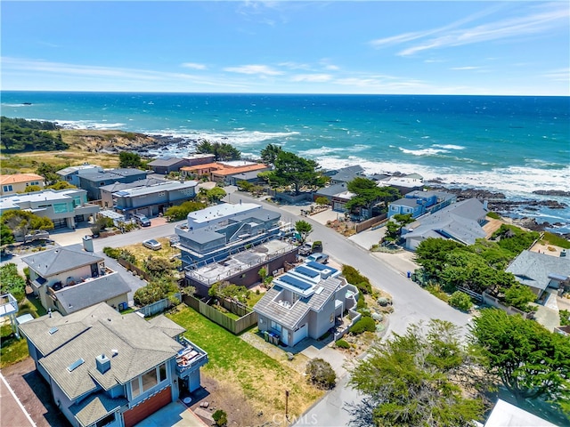 aerial view with a water view and a view of the beach