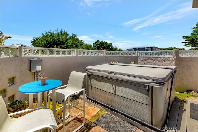 view of patio with a hot tub